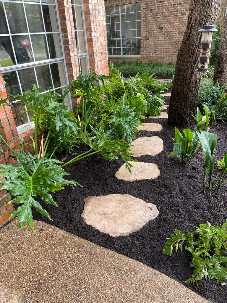 flower beds with stepping stones