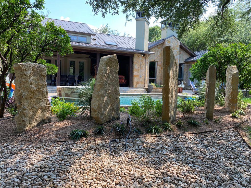 flower beds featuring large accent rocks