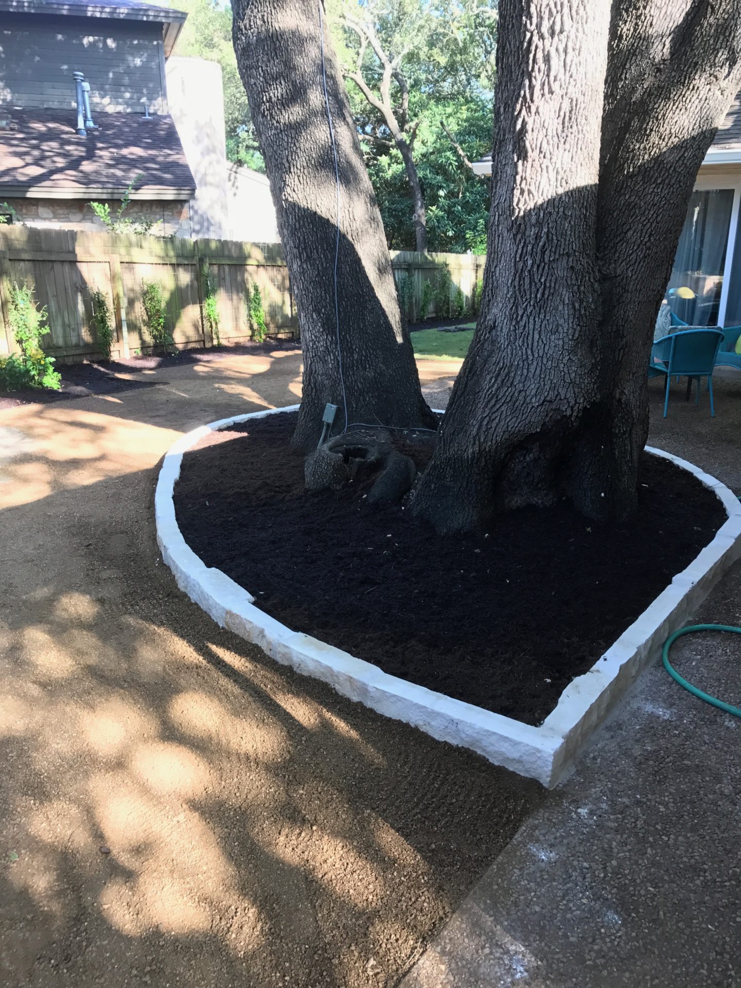 Flower beds around trees